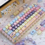 Vibrant Rikka Takanashi Anime Keycaps set, featuring whimsical character art, delicate floral accents, and playful icons on MOA profile keys, an artistic design.