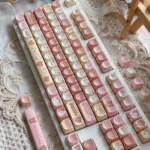 Rilakkuma MOA profile PBT keycaps set. Whimsical Rilakkuma & Kaoru in pastel hues, shown from different angles. Ergonomic comfort, durable PBT.