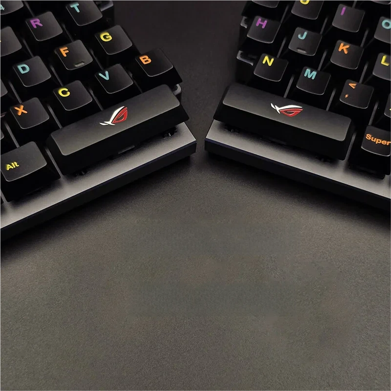 Elevate gaming with this Republic of Gamers: ROG Logo Split Space Key Keycaps, featuring a bold, sculpted metallic design for an aggressive aesthetic.