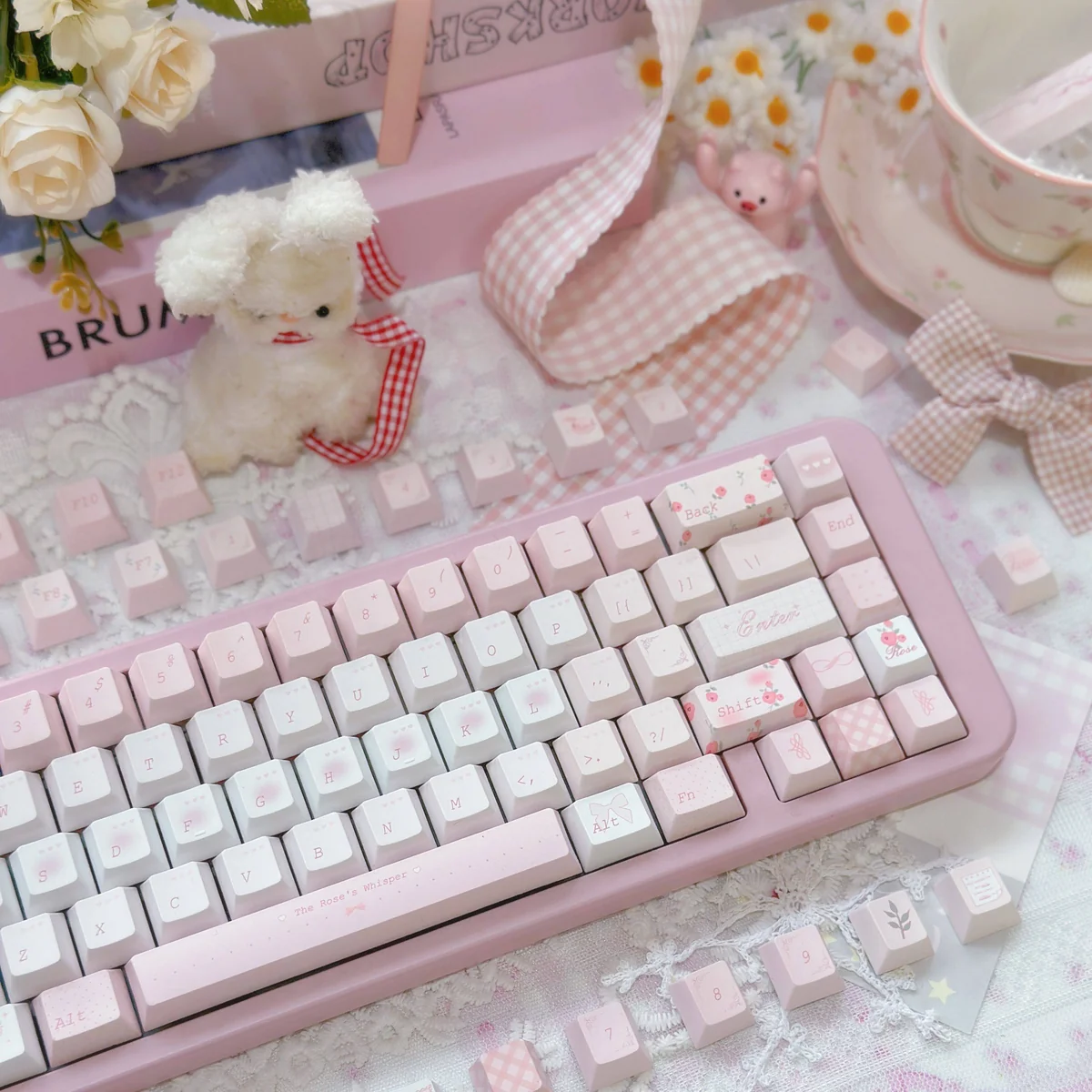 Rose Whisper PBT Dye-sub keycap set displayed from various angles, highlighting delicate rose motifs and soft romantic hues for an exquisite, serene design.