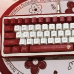 A close-up view of the premium Rose PBT Dye-Sub Keycap Set, showcasing intricate red rose designs from a unique angle, perfect for a romantic, artistic design.