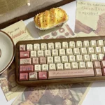 Artistic close-up shots of the Romantic Rose Letter PBT Dye-sub Keycap Set, revealing delicate rose motifs, elegant script, and soft vintage-inspired.