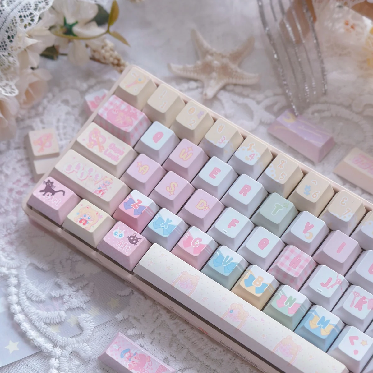 Playful Sailor Moon PBT dye-sub keycaps set, showcasing vibrant pastel anime art and iconic characters across the complete 130-key layout. Perfect for fans.