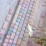 Playful 130-key PBT Dye-Sub Sailor Moon keycaps set from various angles, showcasing vibrant pastel anime characters and magical motifs in detail.