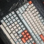 Vibrant Salmon PBT keycaps set, showcasing artistic dye-sublimated designs and oceanic hues from multiple angles. Cherry profile for a fresh desk aesthetics.