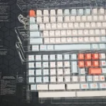 Vibrant Salmon PBT keycaps set, dye-sublimated with artistic oceanic hues and playful textures. Cherry profile, shown from various angles for a fresh desk accessories.