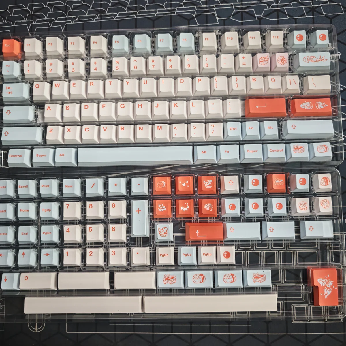 Vibrant Salmon PBT Keycaps Set, dye-sublimated with artistic salmon-inspired colors and oceanic hues, creating a fresh desk aesthetic. Cherry Profile.