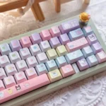 Close-up of a vibrant Sanrio PBT Dye-Sub keycap set showcasing adorable character details, part of a joyful set for kawaii keyboards.