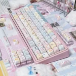 Iconic Sanrio PBT keycaps set, featuring vibrant characters from various playful angles, enhancing any keyboard with their charming aesthetic.