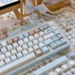 Adorable sheep PBT keycaps set from the Cozy Charm Set, showcasing whimsical pastel sheep designs and crisp, durable dye-sub legends from various angles.