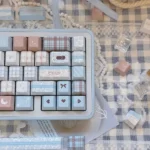 Adorable sheep PBT keycaps set displaying whimsical designs and soft pastel colors. These durable, dye-sub PBT keycaps bring cozy charm to any desktop setup.
