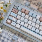 Close-up of Adorable Sheep PBT Keycaps Set, highlighting a whimsical sheep design in soft pastel colors with crisp dye-sub legends, adding cozy charm.