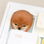A collection of images showcasing the charming handcrafted Shiba Inu ESC keycap from various angles, highlighting its playful design and intricate design.