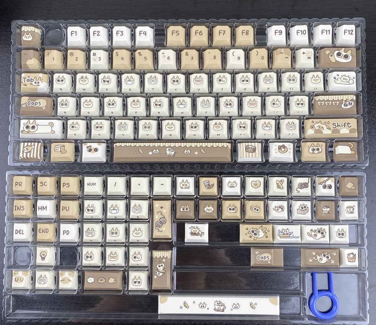 Charming Azukisan Siamese Cat PBT keycaps set, showcasing the whimsical stylized cat motif in warm cream and brown tones, highlighting the endearing artistic view.