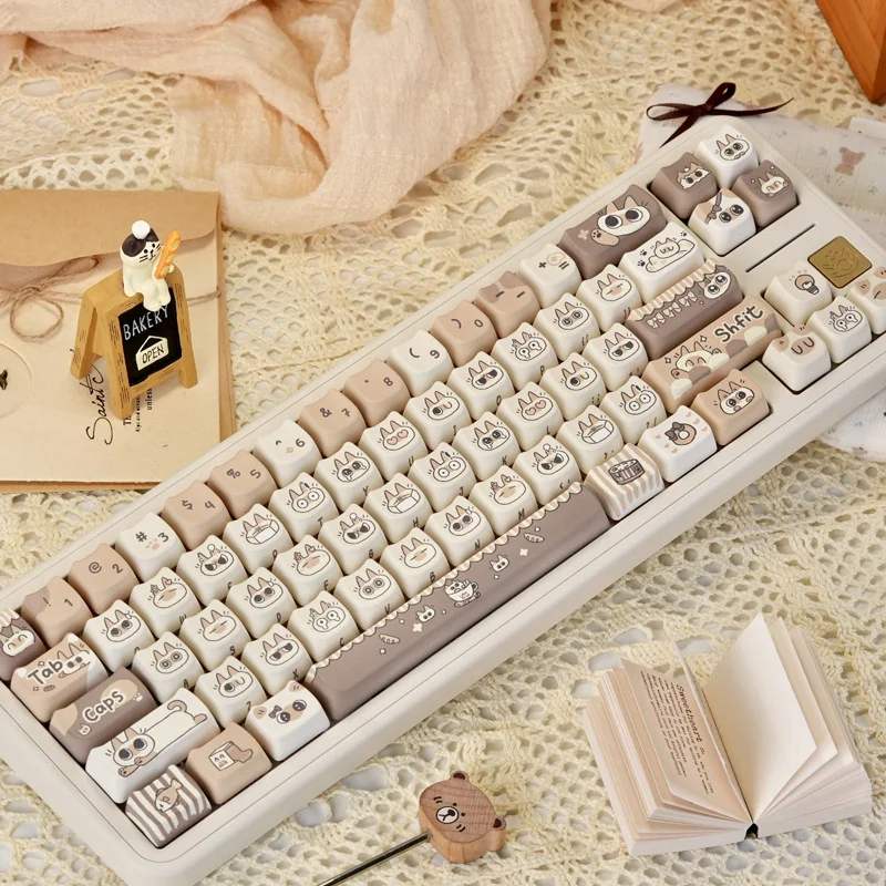Charming Siamese Cat PBT Keycap Set, showcasing whimsical stylized feline designs in warm cream and brown, perfect for custom keyboards.