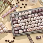 Adorable Siamese Cat MOG Keycap Set, beautifully designed with charming cat motifs and warm colors, shown from a playful, inviting angle.