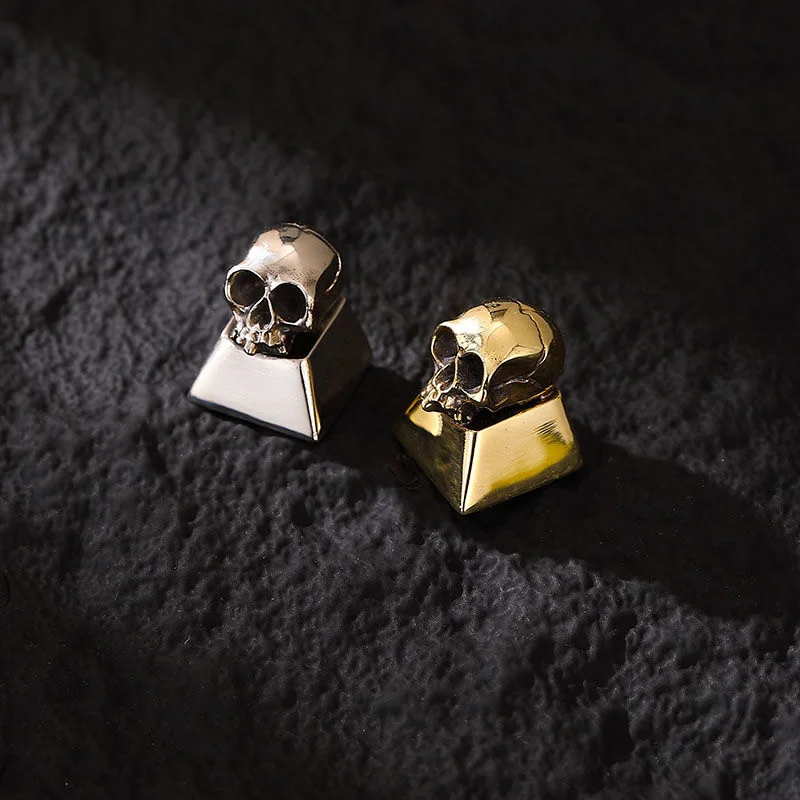 Handcrafted pure alloyskull artisan keycap, side view. Intricate gothic design, raw metallic luster. Premium skull keycap for mechanical keyboard.