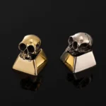 Premium handcrafted pure alloy skull artisan keycap for mechanical keyboards, showcasing intricate gothic design and raw metallic luster from various angles.