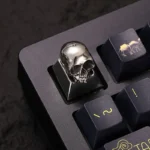 Handcrafted pure alloy skull artisan keycap for mechanical keyboards, featuring its intricate gothic design and raw metallic luster from a striking design.