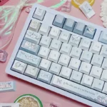 Charming Sleepy Sheep PBT Keycaps Set displayed with adorable pastel sheep motifs for a cozy, whimsical keyboard aesthetic.