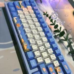 Whimsical Space Bear PBT dye-sub keycaps set. Durable designs featuring playful bear astronauts in vibrant cosmic scenes, shown from multiple angles.