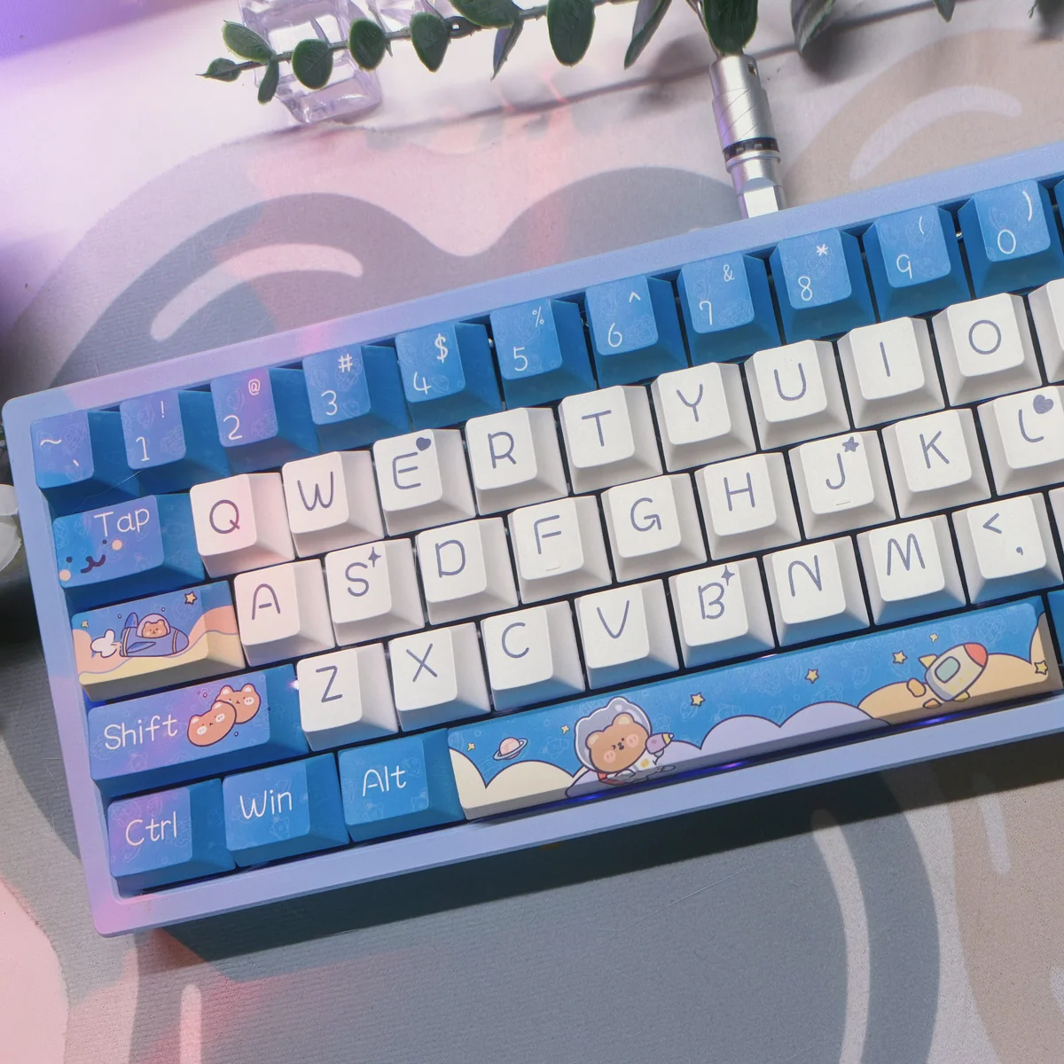 A whimsical Space Bear PBT Dye-Sub keycap set displaying playful bear astronauts exploring a vibrant cosmic landscape, emphasizing durable PBT.
