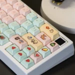 Vibrant Stardew Valley pixel art PBT Cherry keycaps set, displayed from multiple angles, capture the game's charming, nostalgic world with beloved character.