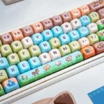 Stardew Valley pixel art PBT keycaps set with charming game scenes and characters. Multiple angles highlight their whimsical rustic beauty.