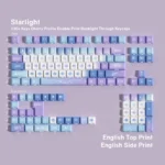 Durable Starlight PBT keycaps set from a new perspective, highlighting their ergonomic design and captivating cosmic wonder with luminous celestial pattern.