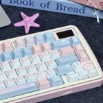 Dreamy Starry PBT Keycaps Set in a detailed view, showcasing durable PBT and vivid pink-blue dye-sub design, emphasizing their serene, artistic aesthetic.