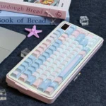 Dreamy starry PBT keycaps set in pastel pink and blue, showcasing vivid dye-sub design and durable PBT from various artistic angles.