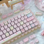 Whimsical Strawberry Cake Bear PBT MOA keycap set, showcasing adorable bear and cake designs from a playful, detailed angle.
