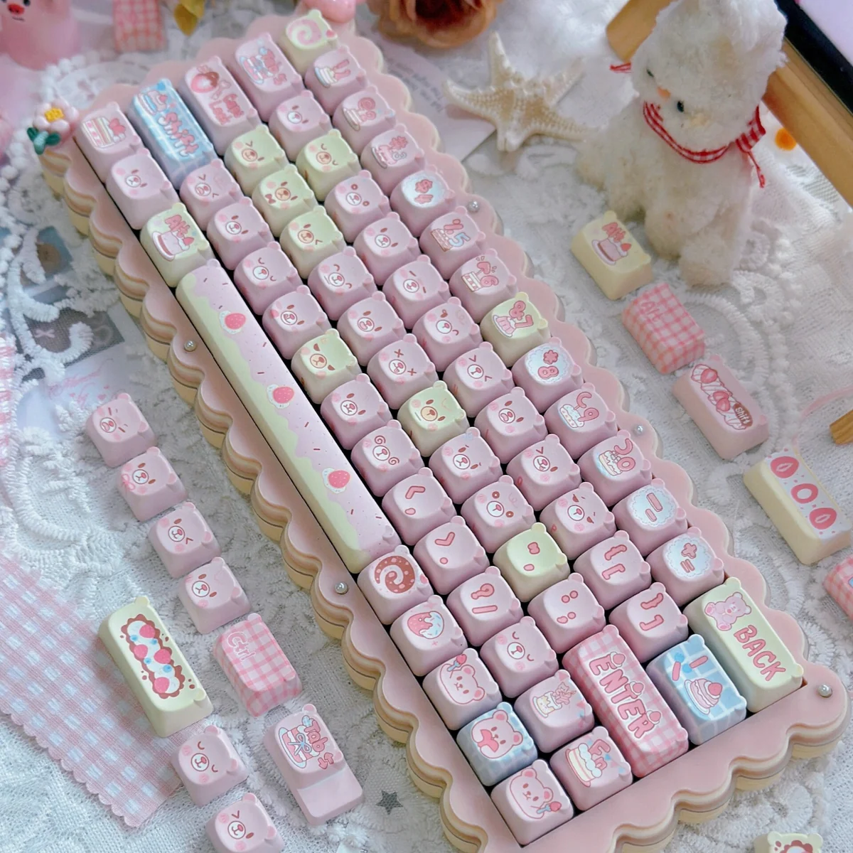 Whimsical Strawberry Cake Bear PBT Keycap Set. Adorable, playful bear and strawberry cake motifs in vibrant pastel hues bring a sweet, dessert-themed.