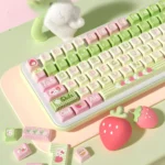 Close-up of a whimsical Strawberry Milk Rabbit PBT keycap set, showcasing adorable pastel hues bunny designs from a unique angle.