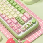 Whimsical Strawberry Milk Rabbit PBT keycaps set arranged, showcasing pastel hues with charming bunny motifs for a sweet, delightful aesthetic.