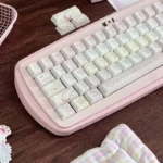 Close-up of Sweet Strawberry Milkshake PBT Dye-Sub Keycaps Set, highlighting their vibrant pastel pinks and playful dessert icons for a whimsical keyboard.