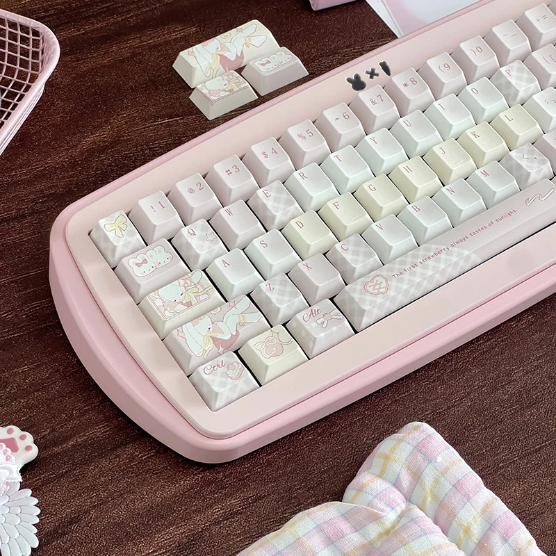 Close-up of Sweet Strawberry Milkshake PBT Dye-Sub Keycaps Set, highlighting their vibrant pastel pinks and playful dessert icons for a whimsical keyboard.