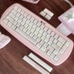 Detailed view of the Sweet Strawberry Milkshake PBT Dye-Sub Keycap Set, highlighting pastel pink dessert-inspired legends from a unique angle.