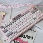 Whimsical Strawberry Rabbit PBT dye-sub keycaps set showcasing adorable pastel strawberries and charming bunnies, enhancing a sweet desktop aesthetic.