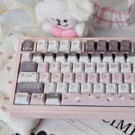 Delightful close-up of the Whimsical Strawberry Rabbit PBT Dye-sub Keycap Set, showcasing adorable pastel designs for a sweet desktop aesthetic.