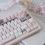 Adorable Whimsical Strawberry Rabbit PBT Dye-sub Keycap Set, showcasing its sweet pastel strawberry and rabbit designs from various angles.