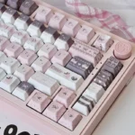 Whimsical Strawberry Rabbit PBT dye-sub keycap set. Adorable pastel illustrations of strawberries and charming rabbits create a sweet desktop look.