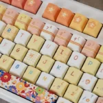 Cheerful Sunflower PBT Keycap Set showcased from multiple angles, highlighting its vibrant dye-sublimation and durable PBT material. This joyful keyboard.