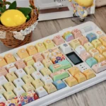 Close-up of a vibrant, cheerful sunflower PBT keycap set, showcasing its durable dye-sublimated design with whimsical cartoon details for joyful keyboard.