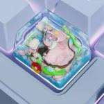 Multiple views of the handcrafted Sylveon keycap, highlighting its playful pink hues and whimsical artisan charm for Pokemon fans.