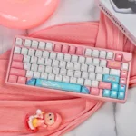 A whimsical Sylveon PBT keycap set for mechanical keyboards, featuring its iconic pastel design and durable texture from a charming, detailed angle.