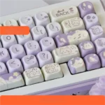 Adorable Taro Paste Kitten PBT dye-sub MOA keycaps set showcased from multiple angles, highlighting the soft pastel purple, white, and cute kitten designs.