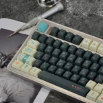 An artistic close-up of the exclusive Tears of Kingdom PBT keycap set, showcasing intricate Hyrule landscapes and ancient symbols from multiple angle.