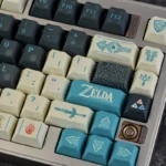 Close-up of the exclusive Tears of the Kingdom PBT keycap set, showcasing intricate Hyrule symbols and mystical artistic details on a mechanical keyboard.