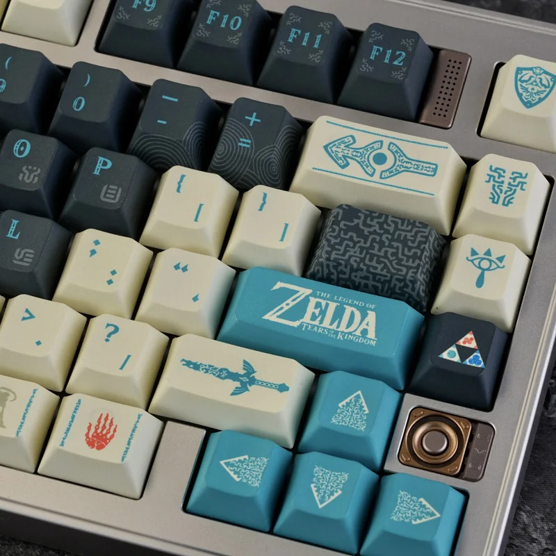 Close-up of the exclusive Tears of the Kingdom PBT keycap set, showcasing intricate Hyrule symbols and mystical artistic details on a mechanical keyboard.